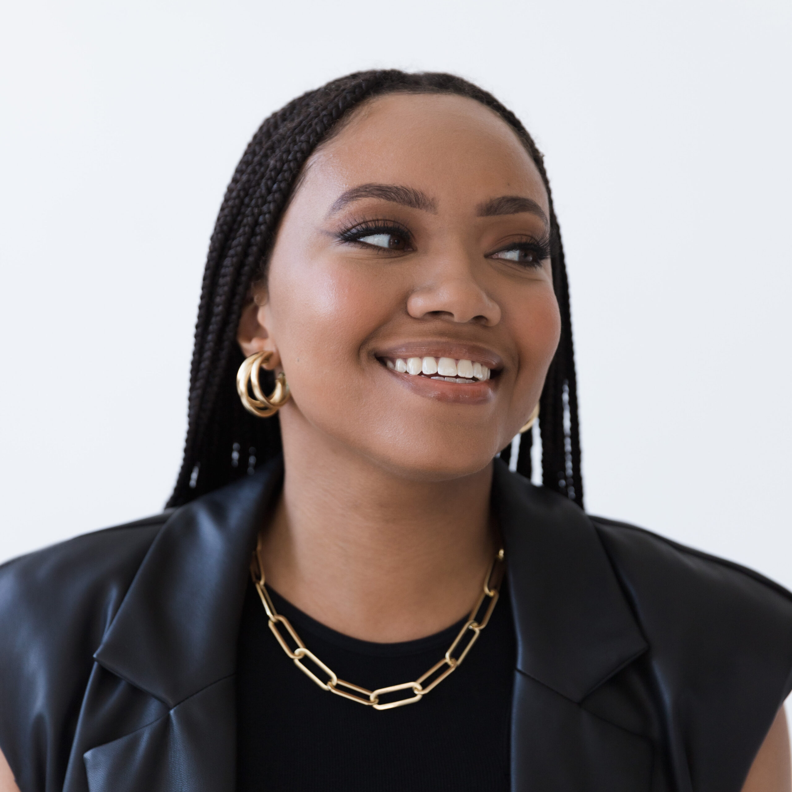 Calen Headshot - square A photo of Racine Public Library board trustee Calen Nelson, a Black woman wih long, braided hair.